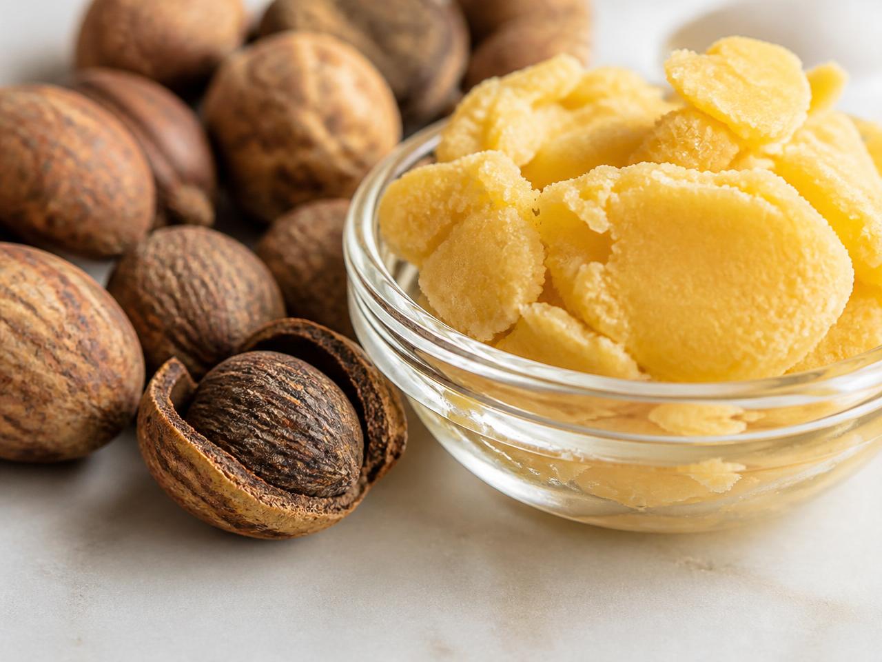 Raw shea nuts and premium golden shea butter